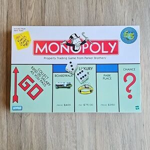 Monopoly 65th Anniversary Game with Winning Token Piece Like New